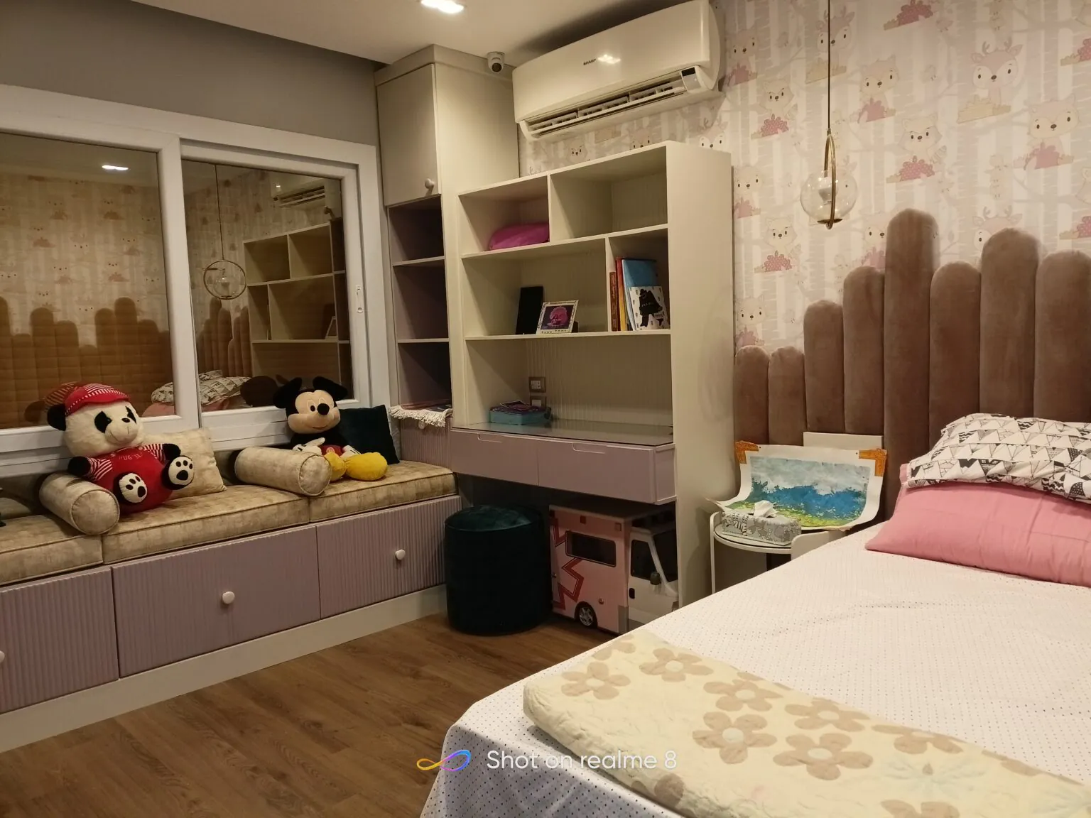 Playful kids’ room with plush pink furniture, built-in shelving, and decorative elements in Cairo from Consept Art's site work portfolio.