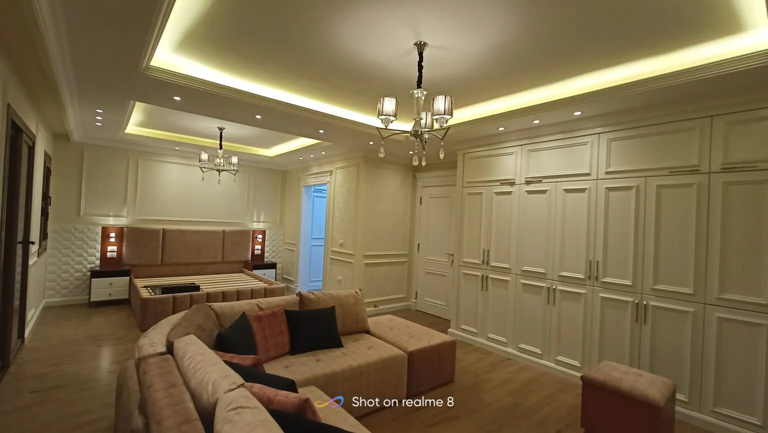 Modern living area with sleek furniture, and warm ambient lighting.